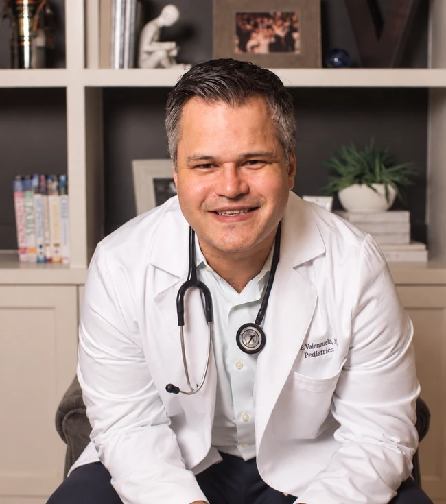 Dr. Eddie Valenzuela, MD, FAAP, board-certified pediatrician and founder of Happy Cappy