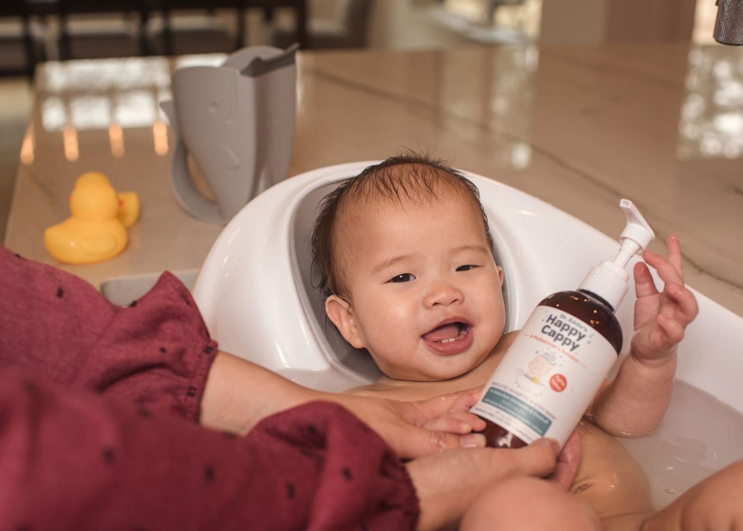 Baby using Happy Cappy Shampoo