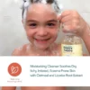 Child lathering hair and holding Happy Cappy Daily Shampoo, with oatmeal and licorice root extract highlighted.