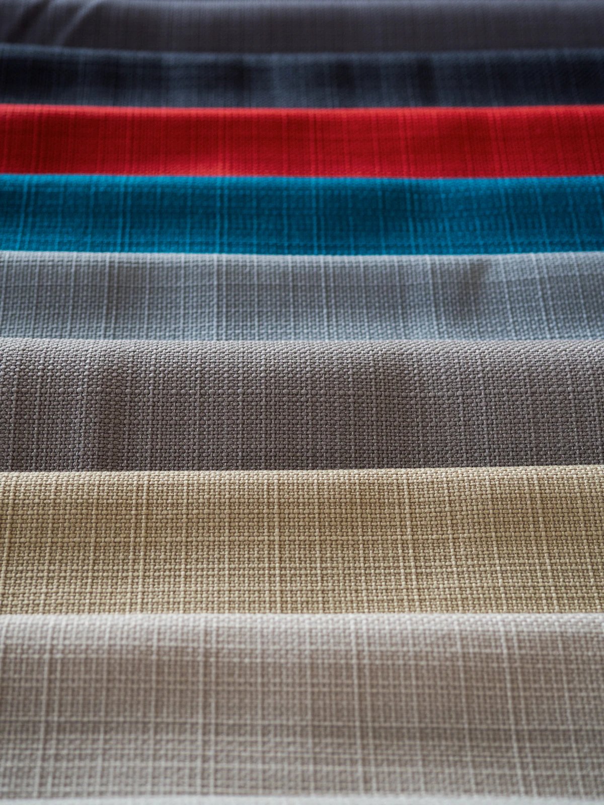 Rows of fabric swatches showing different surface textures and weaves