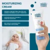 Happy Cappy Moisturizing Cream tube with skin-barrier and hydration benefits, beside a baby wrapped in a towel