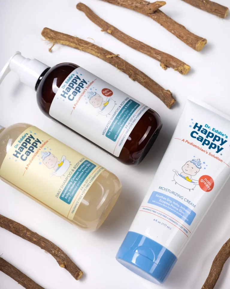 Happy Cappy Medicated Wash, Daily Wash and Moisturizing Cream arranged with licorice roots.