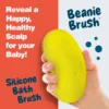 Hand holding the yellow Happy Cappy Beanie Brush, showing its back and curved shape.